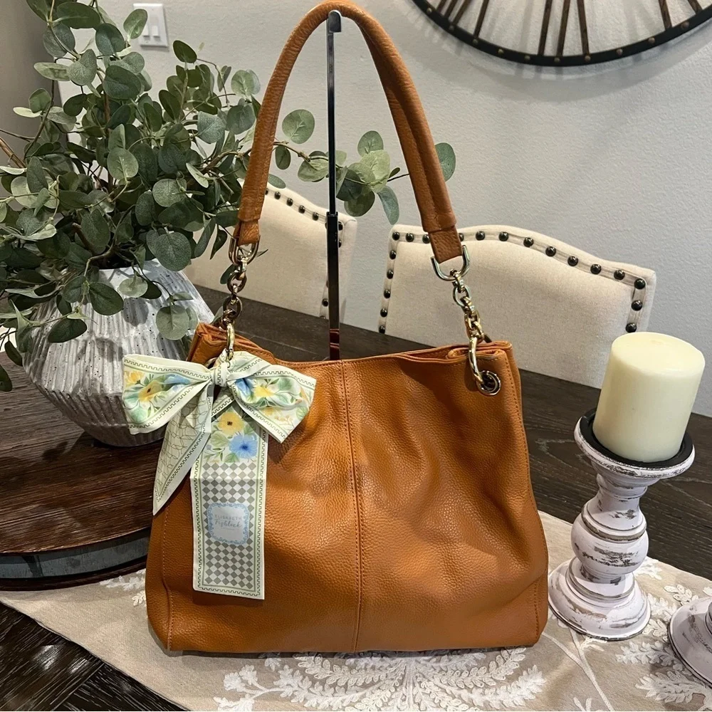 Elegant Currie & Pelle Tan Leather Handbag with Gold Accent